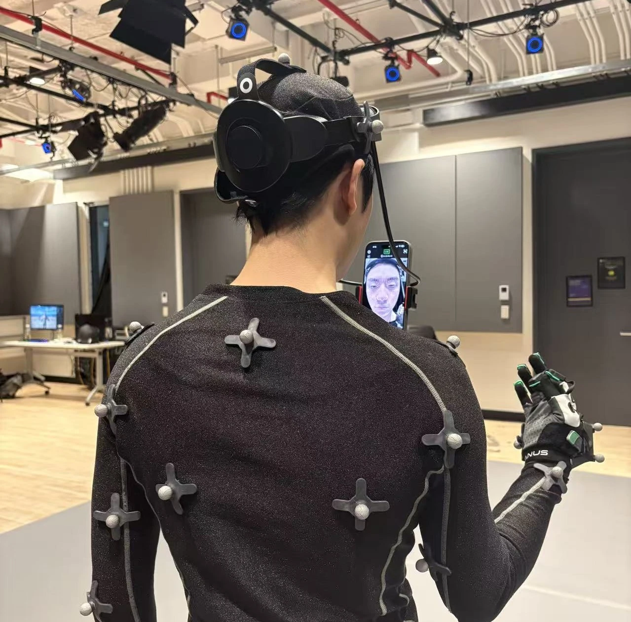 Motion-capture performer wearing a headset and tracking suit